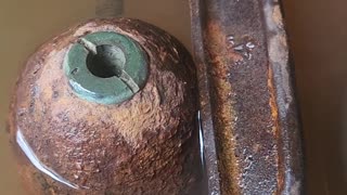 Cleaning an Old Artillery Shell