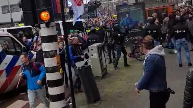 Protestors and Riot Police Clash in Amsterdam Over COVID Lockdowns and Mandates