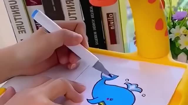 Children really like this projection painting machine