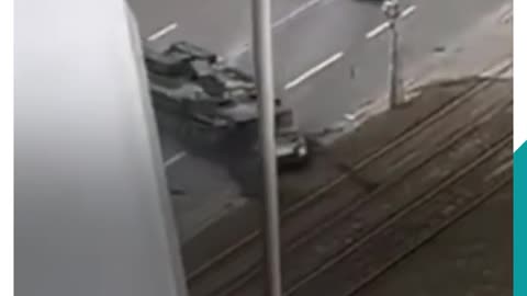 Armoured vehicle drives over a civilian car in Kiev