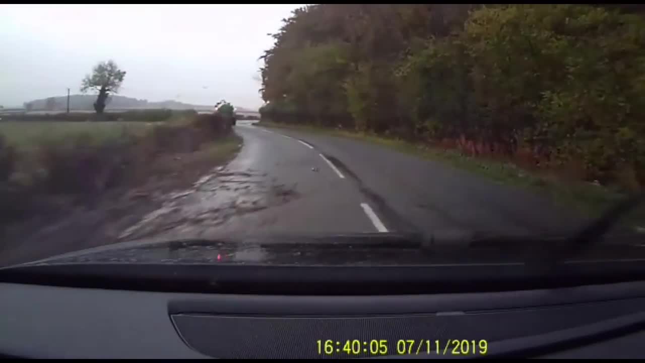 Tractor Nearly Loses Control As He Is Sucked Into The Verge