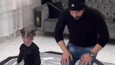 Baby praying with father