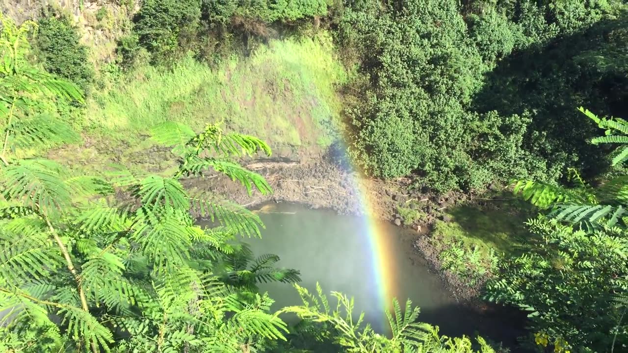 Amazing rainbow at waterfalls on island of Kauai, Hawaii