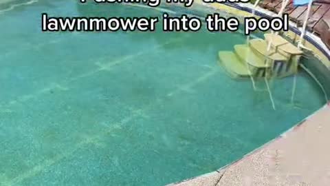 Pushing my dads lawnmower into the pool