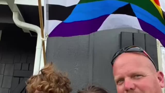 Father And Son Duo Fixes Pride Ally Flag Outside Their House To Show Support