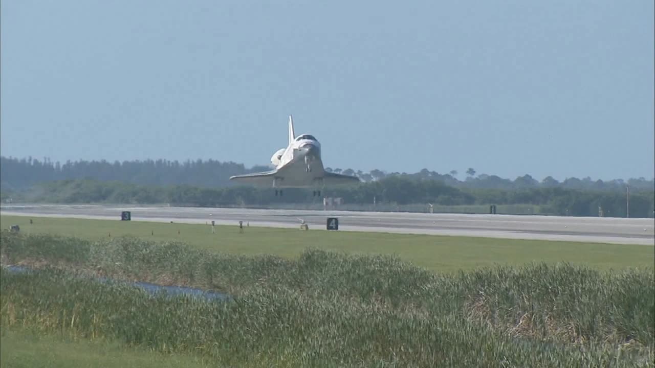 Space shuttle landing on runway