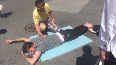 Luodong Massages Skinny White Bearded Man On Sidewalk