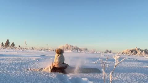 Girl Playing in Deep Snow in Russia