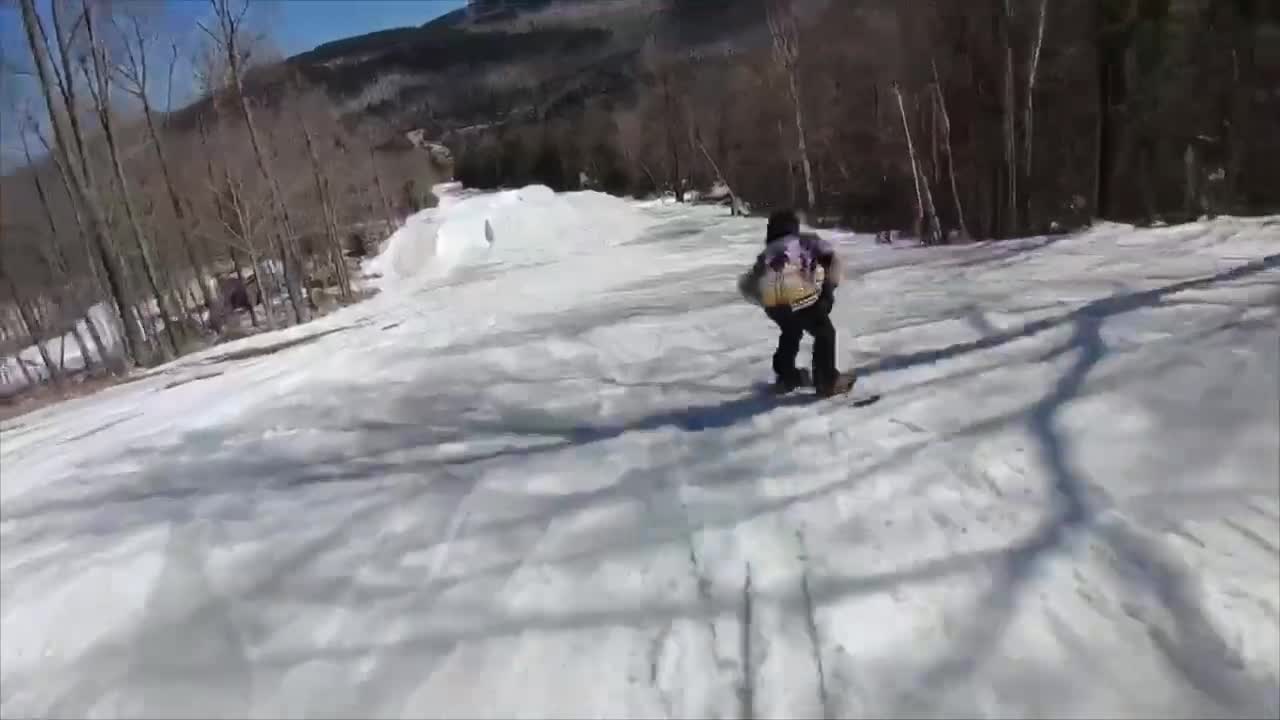 Guy Fails to Land After Attempting a Rotating Spin Trick While Snowboarding