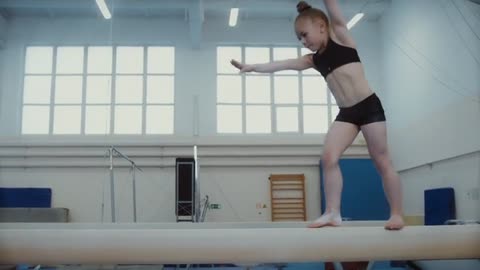 A Little Girl Balancing and Executing an Exhibition at the Beam