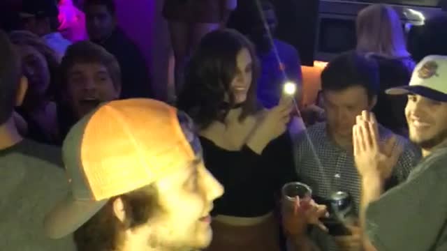 Guy in white hat punches guy in orange hat on cheek