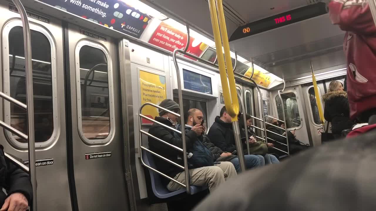 Man in red leather jacket spinning listening to music