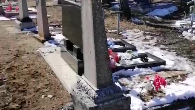 Ukrainian dug in right in the cemetery. And mocking at the graves