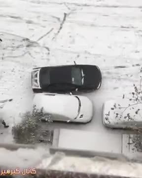 Cars sliding in snow in Tehran