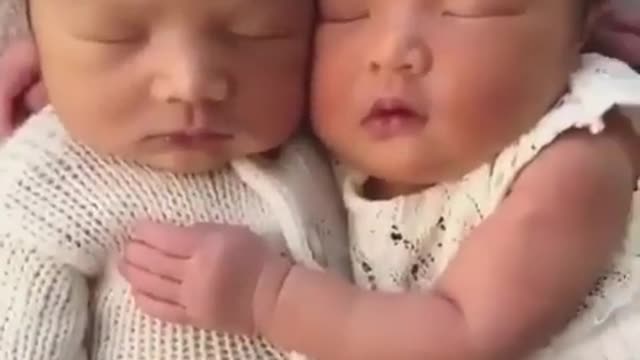 cute child sleeping with his brother