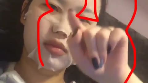 Girl with facemask on tries to do the disneyland channel sign