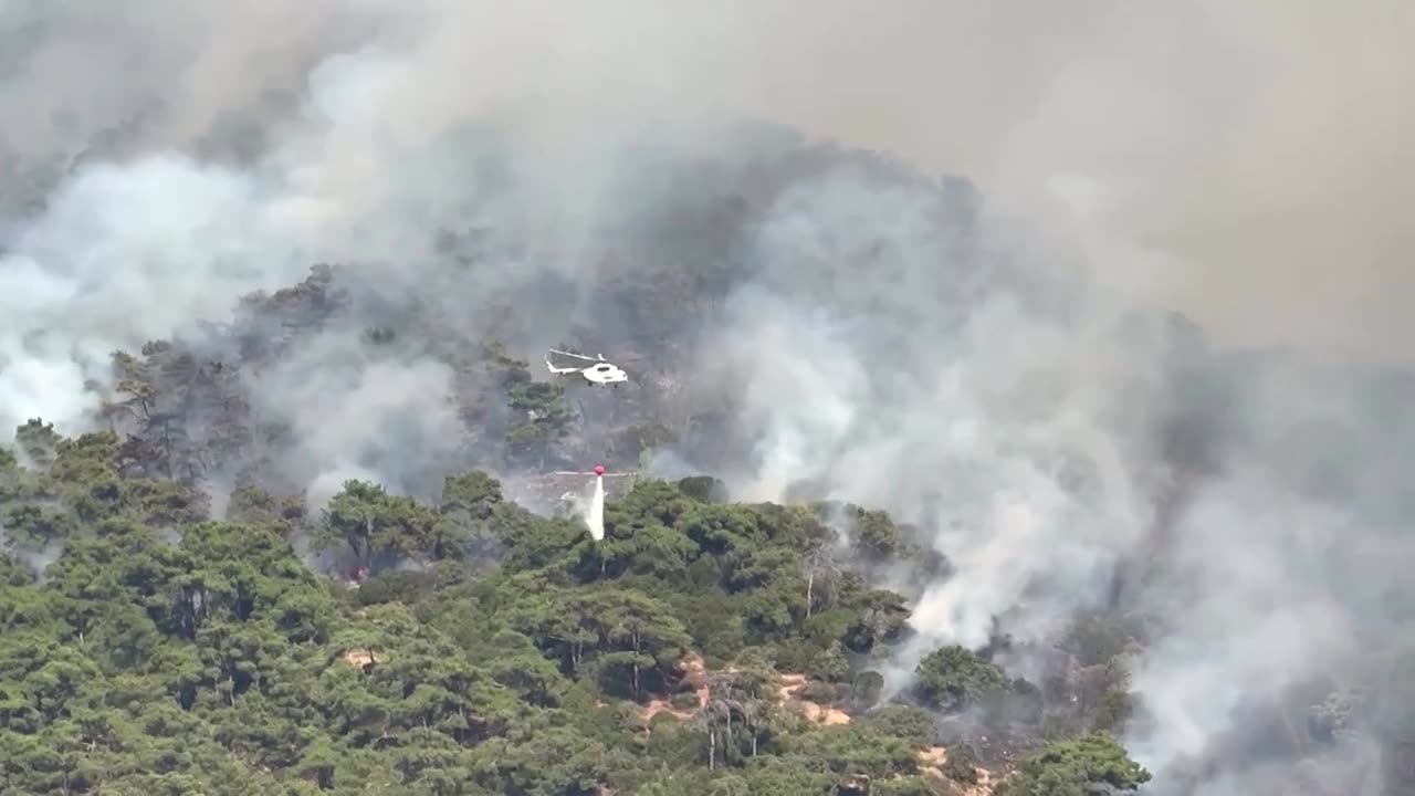 Wildfires fanned by strong winds blaze in western Turkey