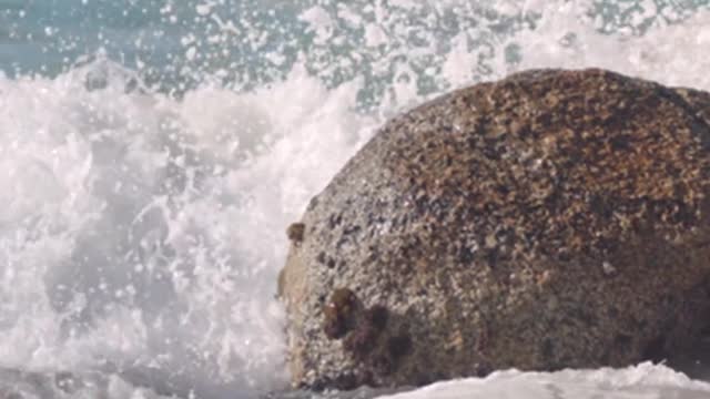 Waves Crashing on Boulders