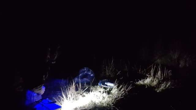 Positioning and setting up the lights for filming at night. DARTMOOR