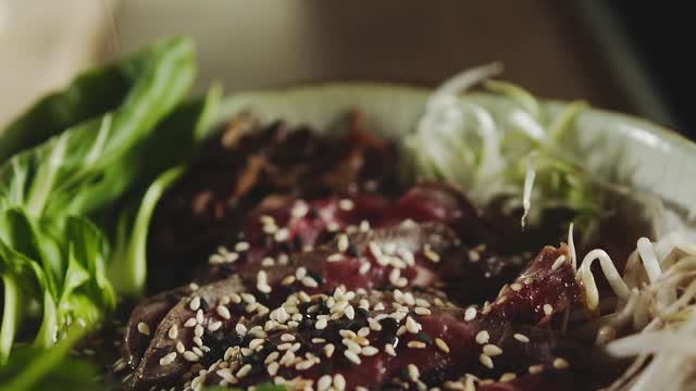 Sprinkle Of Sesame Seeds On Top Of A Beef Bowl