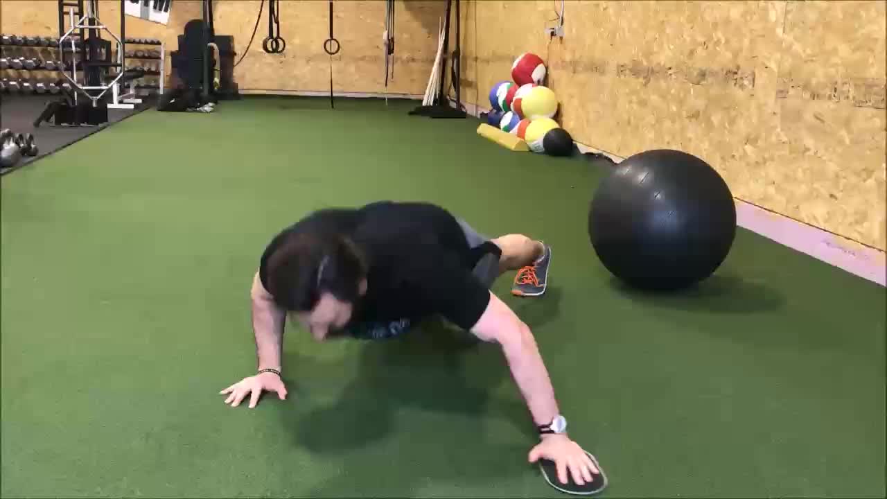 1 arm pushup + lateral slider reach