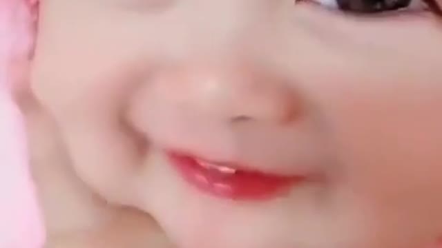 Very cute Asian baby loving to listen to music