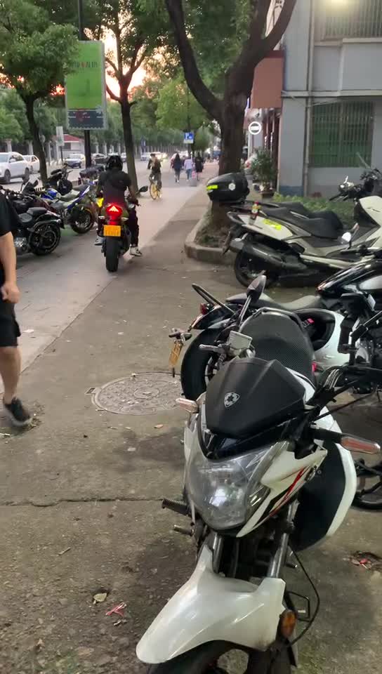 I'm riding my dog's motorcycle home with my landlord.