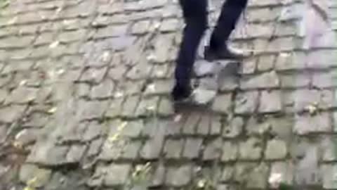 Guy jumps on roof falls on grass