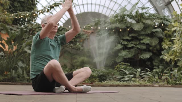 Man Practicing Yoga While Sitting