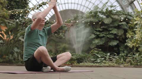 Man Practicing Yoga While Sitting