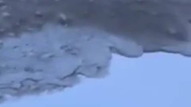 Ocean waves freezing with intense cold