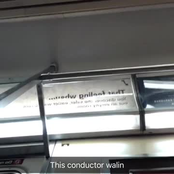 This conductor walin man films inside subway train