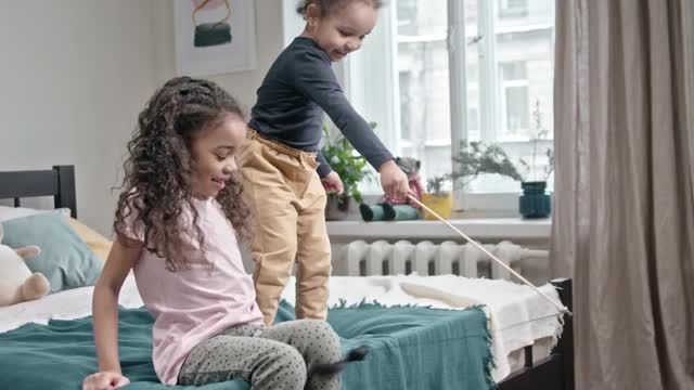 kids playing with Cat