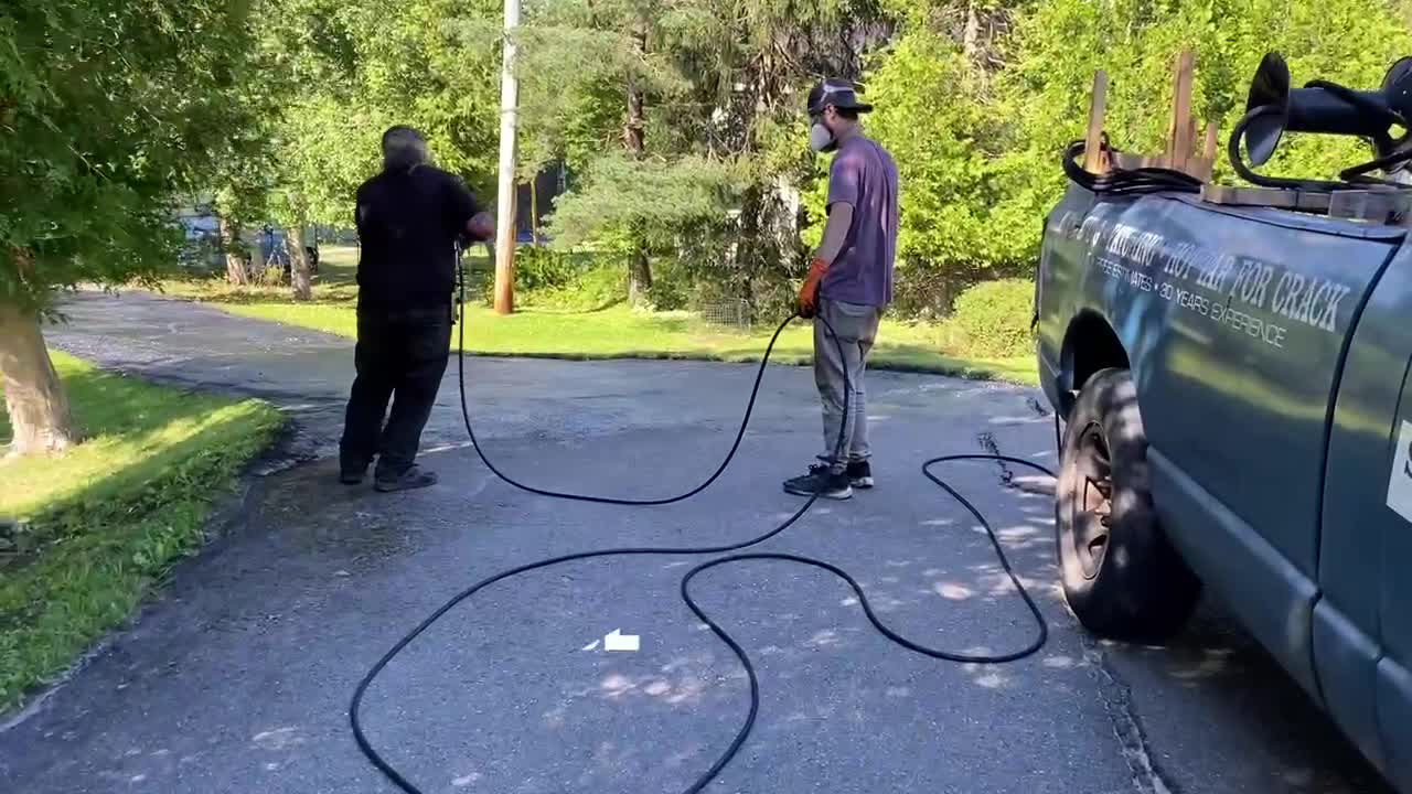 Professional Asphalt Spray Sealing: “The Rough One” Top Coats Pavement Maintenance