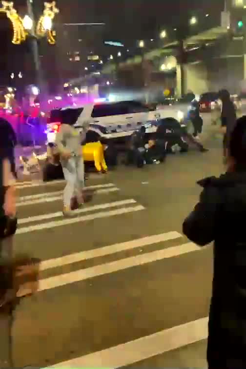 Surrounded by a mob, Tacoma police SUV barrels through crowd, runs over at least one