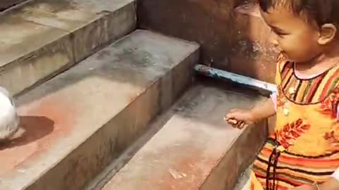 little girl playing with rabbit