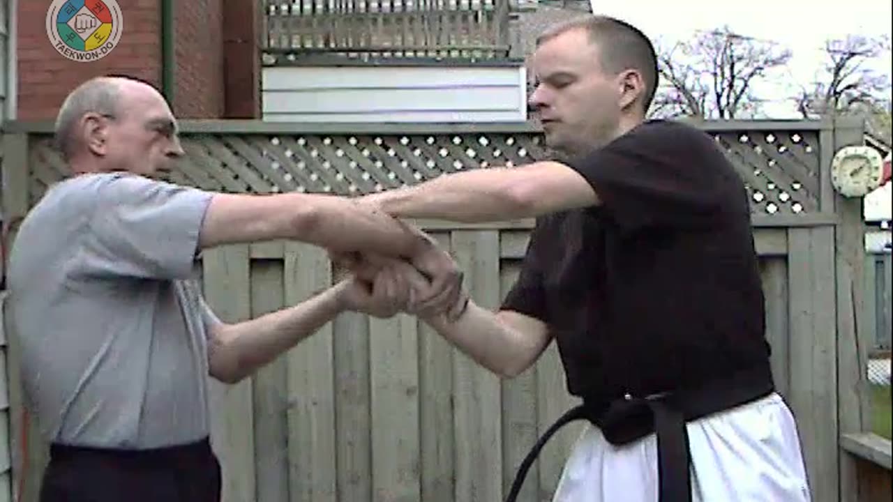 Baehr Taekwondo: white-belt-two-hand-holding-01-closeup