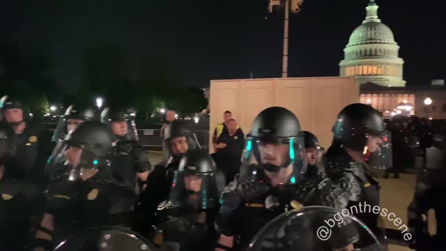 Washington, D.C.: Protesters Berate Police Officers in Riot Gear Before They File Back to the U.S. Capital Building