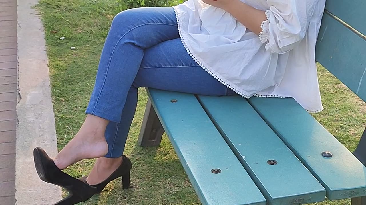 Dangling heels in park