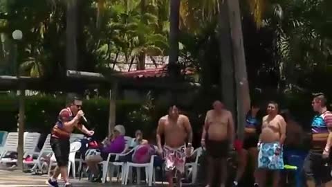 Guy at resort belly flops into pool
