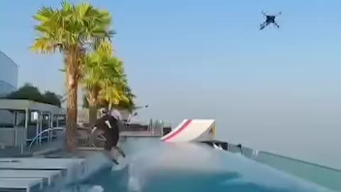 Amazing! Man Surfs Waterway On Top Of Skyscraper & Then Does This!