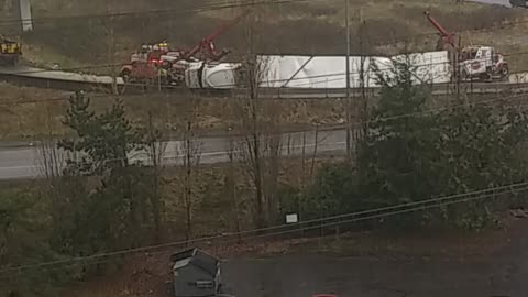 Overturned semi lifted back up