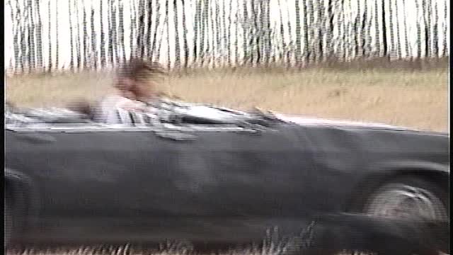 rain driving old car in field movie
