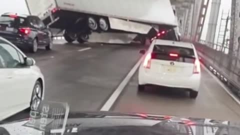 Strong Wind blows A Delivery Truck Of A Bridge In California