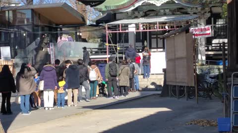 Japanese at the shrine making a New Years Wish