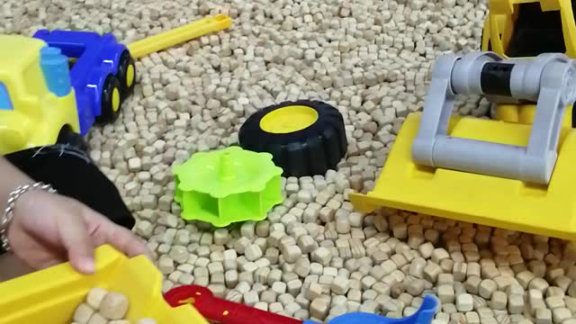 Smart toddler playing with material excavator at supermarket - part 2