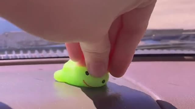 Putting a dollar store squishy on my dash in 110 degree weather3