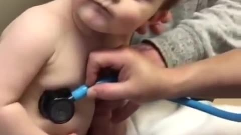 sweet baby boy rests head on nurse