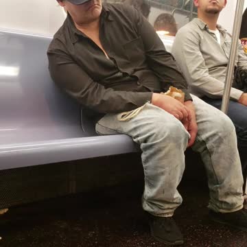 Guy ny hat falling asleep leaning subway train seat