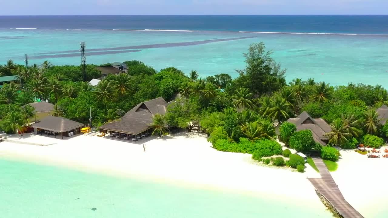 Tourist island with a pier and bungalows